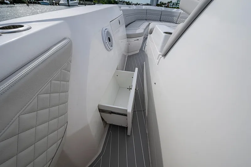 Slide: The Image of 2023 Intrepid 427 Nomad SE boat interior with open storage drawer. - 18