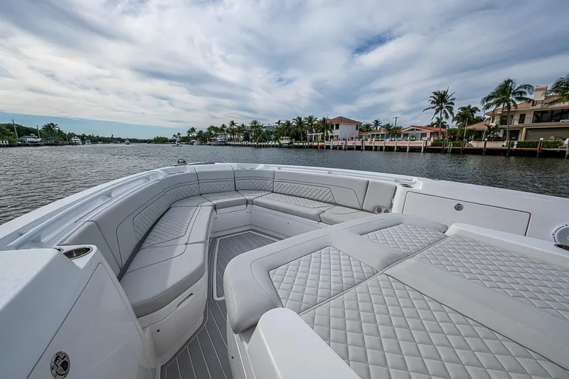 Slide: The Image of Luxurious seating on 2023 Intrepid 427 Nomad SE boat, with waterfront view. - 2