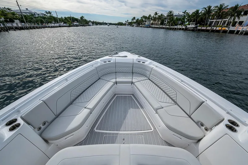 Slide: The Image of Luxurious seating on 2023 Intrepid 427 Nomad SE boat, cruising along a scenic waterway. - 3