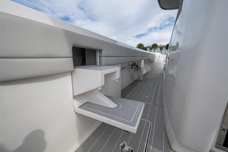 Slide: The Image of 2023 Intrepid 427 Nomad SE boat interior with fold-out step and sleek design. - 32