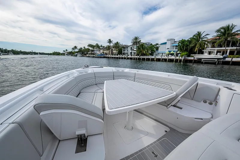 Slide: The Image of Luxurious seating area on 2023 Intrepid 427 Nomad SE boat, with waterfront view. - 4