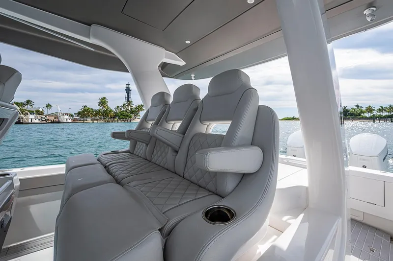Slide: The Image of 2023 Intrepid 427 Nomad SE luxury seating with ocean view and palm trees. - 46
