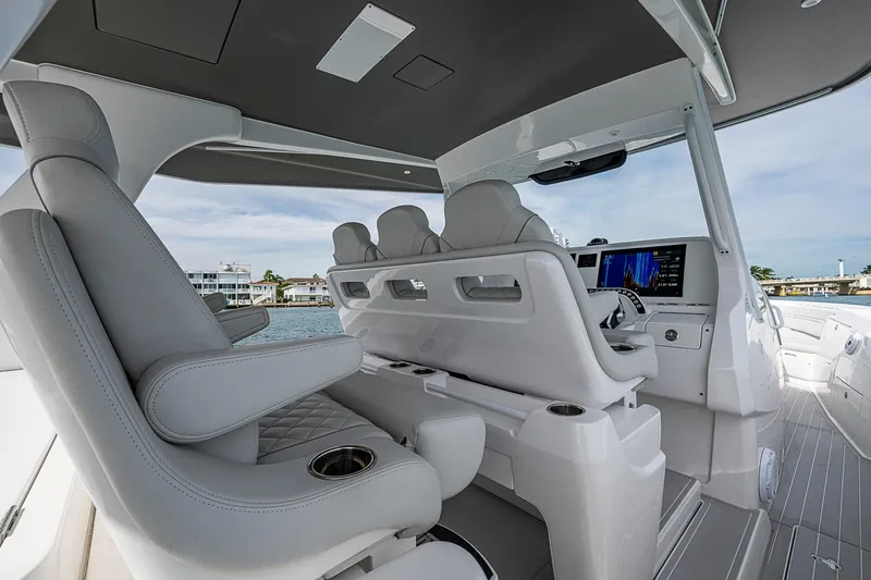 Slide: The Image of Luxurious interior of 2023 Intrepid 427 Nomad SE boat with modern seating and navigation system. - 48