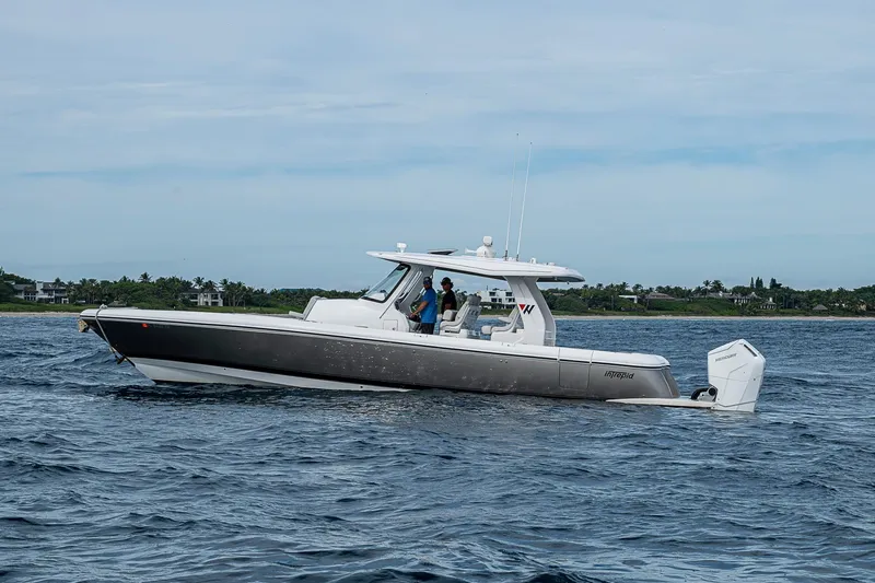 Slide: The Image of 2023 Intrepid 427 Nomad SE boat cruising on open water. - 51