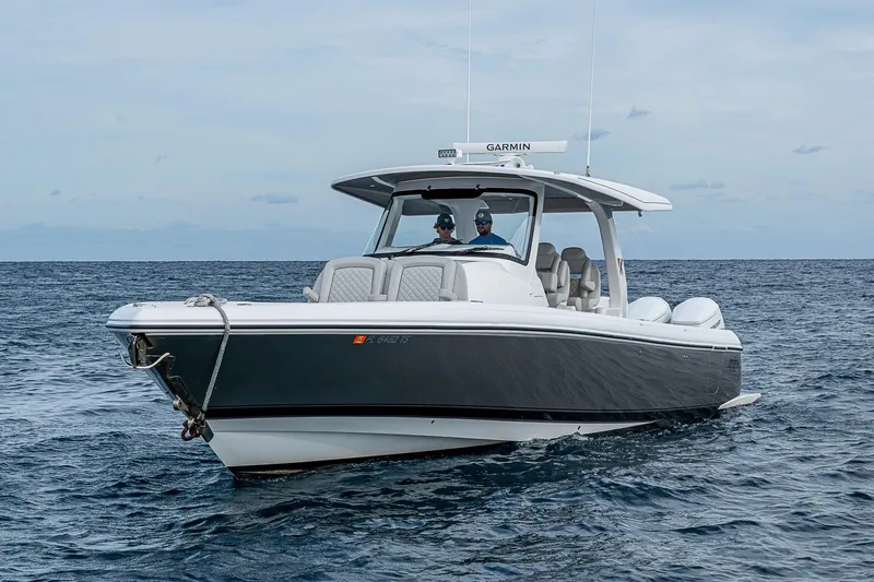 Slide: The Image of 2023 Intrepid 427 Nomad SE boat cruising on open water. - 52