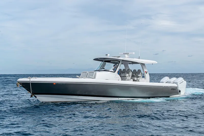 Slide: The Image of 2023 Intrepid 427 Nomad SE boat cruising on open water. - 55