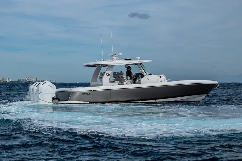 Slide: The Image of 2023 Intrepid 427 Nomad SE cruising on open water under clear skies. - 63