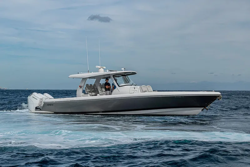 Slide: The Image of 2023 Intrepid 427 Nomad SE cruising on open ocean waters. - 65