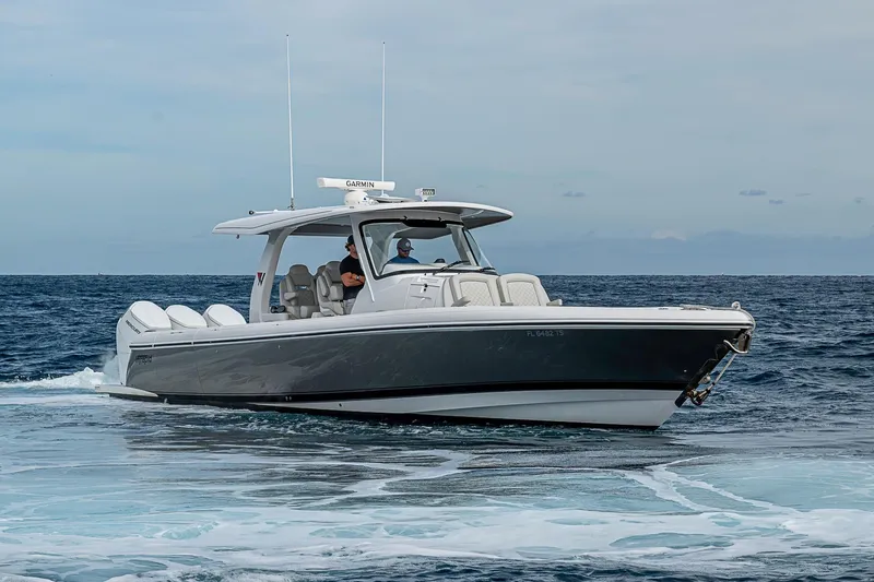 Slide: The Image of 2023 Intrepid 427 Nomad SE boat cruising on open water. - 66