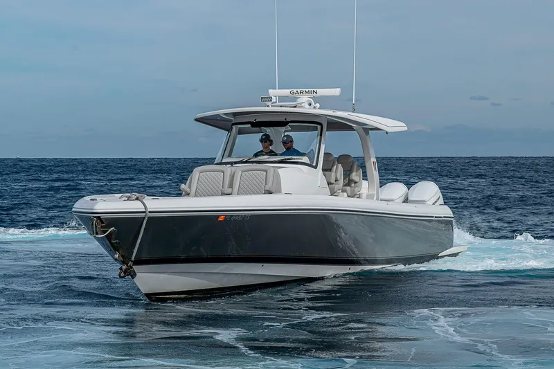 Slide: The Image of 2023 Intrepid 427 Nomad SE boat cruising on open water. - 67