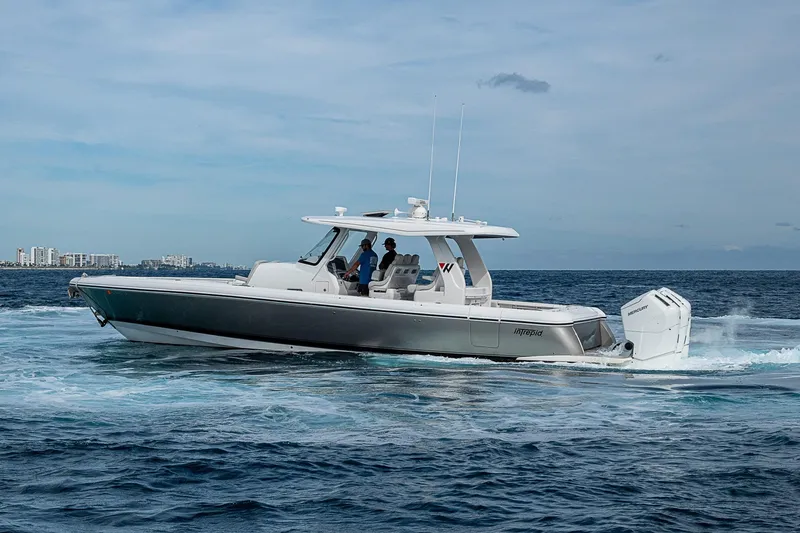 Slide: The Image of 2023 Intrepid 427 Nomad SE cruising on open water under a clear sky. - 71