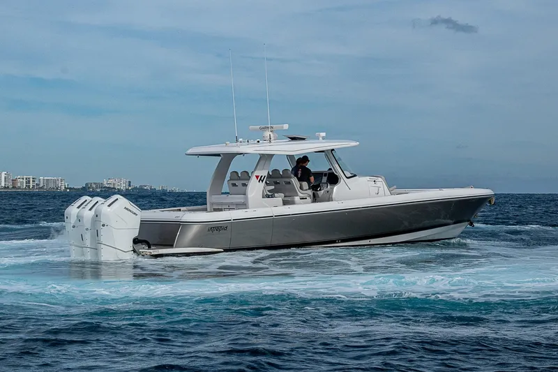 Slide: The Image of 2023 Intrepid 427 Nomad SE boat cruising on open water. - 73