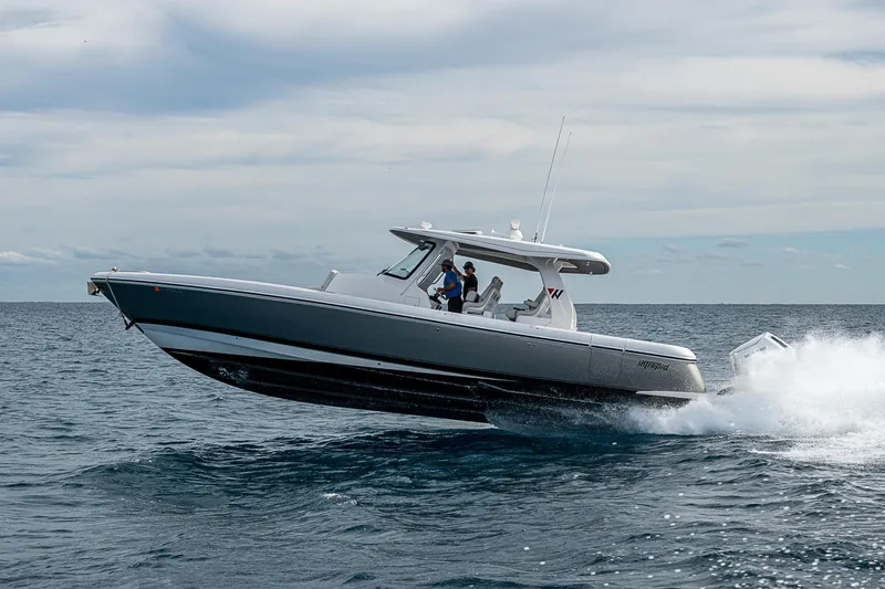 Slide: The Image of 2023 Intrepid 427 Nomad SE boat cruising on open water. - 81