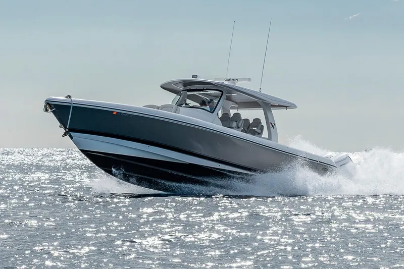 Slide: The Image of 2023 Intrepid 427 Nomad SE boat cruising on sparkling water. - 94