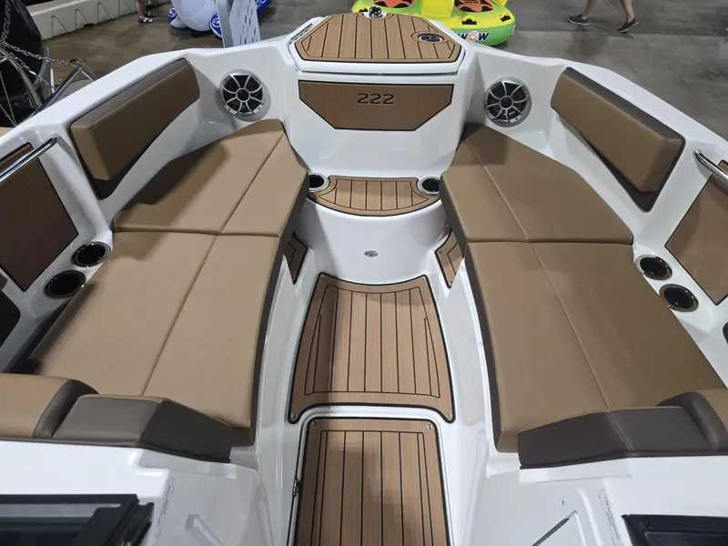 Slide: The Image of Interior of Yamaha Boats 222S 2025 with brown seating. - 11
