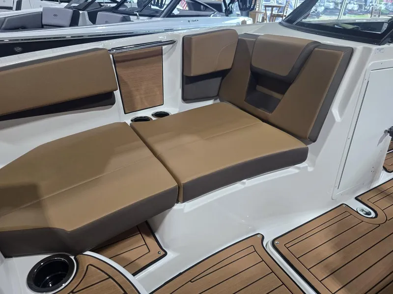 Slide: The Image of Interior of 2025 Yamaha Boats 222S with brown seating. - 12