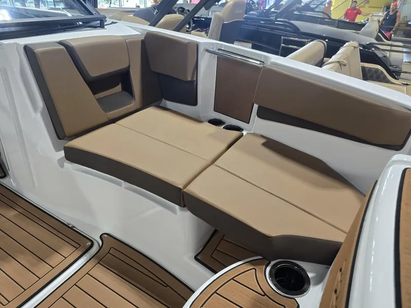 Slide: The Image of Interior of Yamaha Boats 222S 2025 with brown seating. - 13