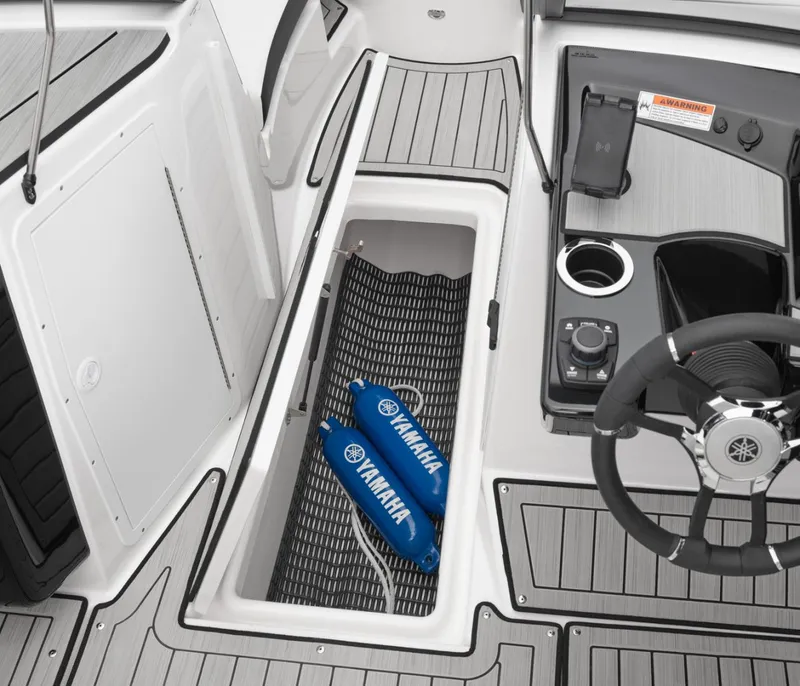 Slide: The Image of Yamaha 222S 2025 boat cockpit with storage and control console. - 25