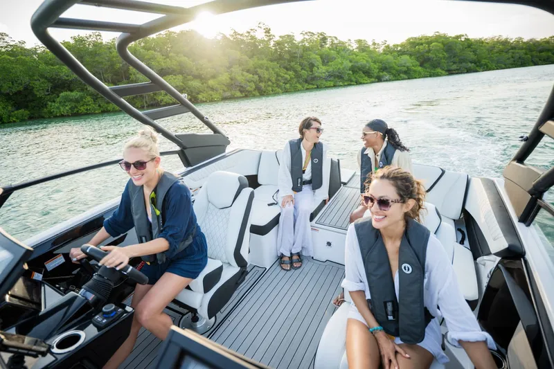 Slide: The Image of Women enjoying a ride on a 2025 Yamaha 222S boat. - 28