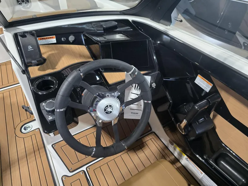 Slide: The Image of Interior of 2025 Yamaha Boats 222S with modern helm. - 7