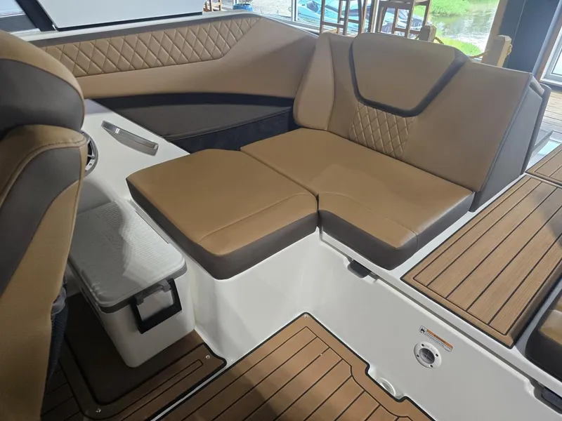 Slide: The Image of Interior of 2025 Yamaha Boats 222S with brown leather seating. - 9