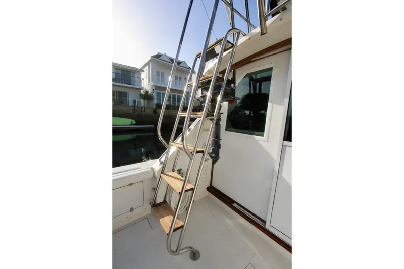 Slide: The Image of custom welded Stainless steel ladder on 1980 Bertram 35 Flybridge - 15