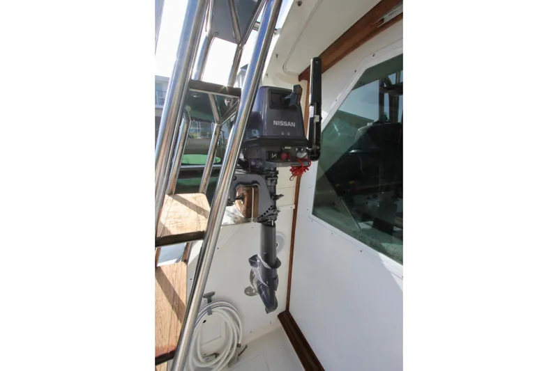 Slide: The Image of 1980 Bertram 35 Flybridge custom outboard motor mount. - 16