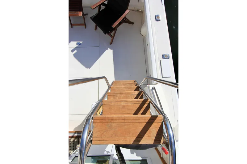 Slide: The Image of Teak steps on custom welded flybridge ladder. - 19