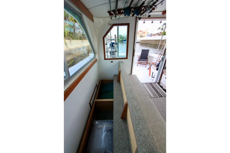 Slide: The Image of Ample storage under convertible sofa. Starboard side convertible sofa. Custom Interior by Crystaliner Corp. - 36