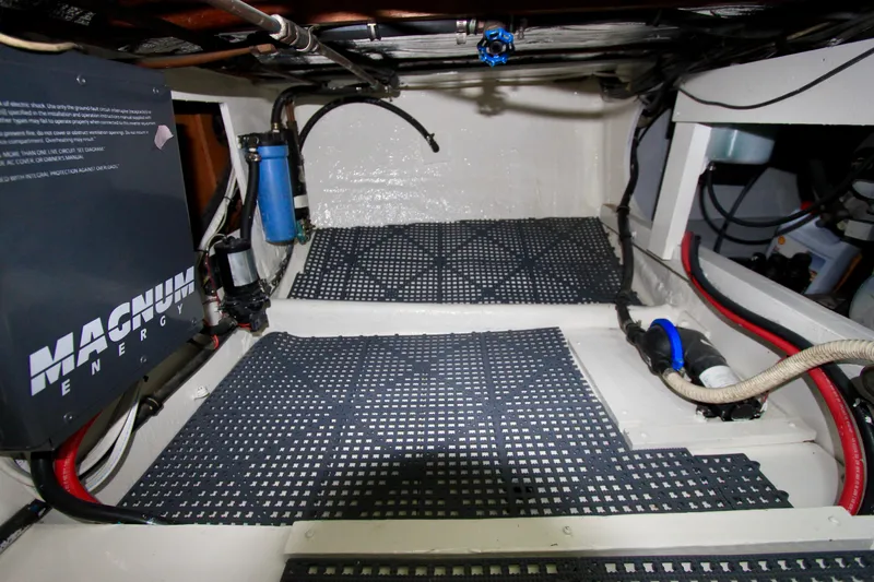 Slide: The Image of Starboard side storage, water pumps and inverter/charger. - 53