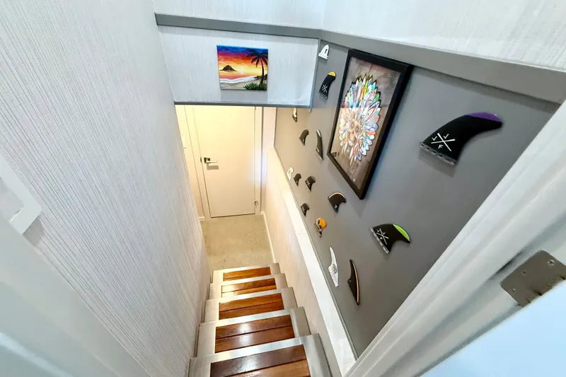 Slide: The Image of Staircase in 2021 BRAVADA YACHTS Atlas V Series 8018 with decorative wall art. - 17