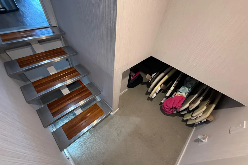 Slide: The Image of Modern staircase and storage area on 2021 BRAVADA YACHTS Atlas V Series 8018. - 18