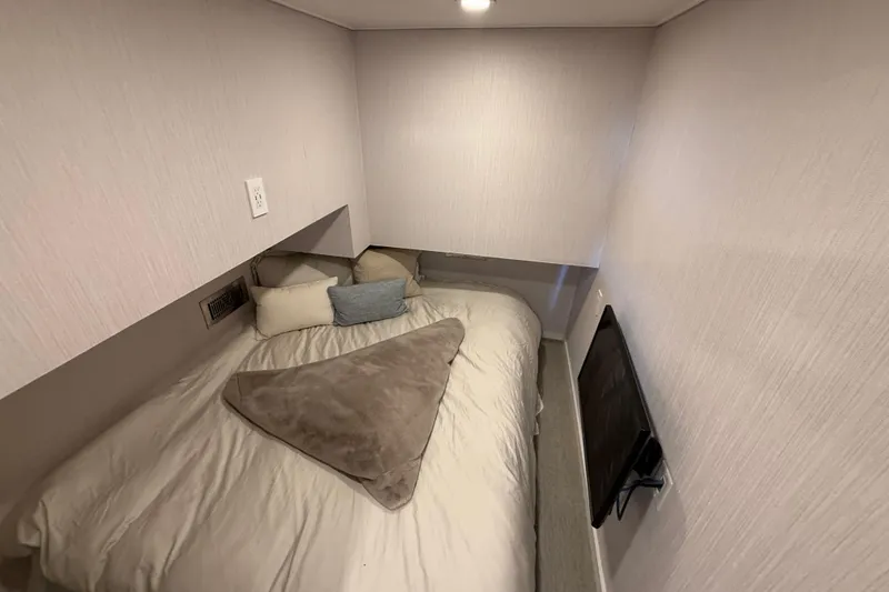 Slide: The Image of Cozy bedroom in 2021 Bravada Yachts Atlas V Series 8018 with TV and plush bedding. - 20