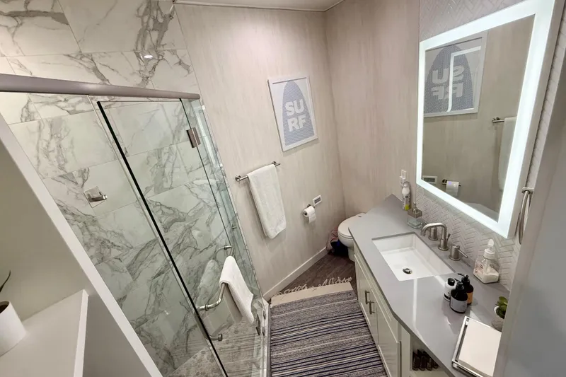 Slide: The Image of Luxurious bathroom on 2021 BRAVADA YACHTS Atlas V Series 8018 with marble shower and modern fixtures. - 24