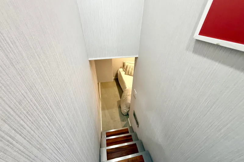 Slide: The Image of Staircase leading to a cozy bedroom in 2021 BRAVADA YACHTS Atlas V Series 8018. - 26