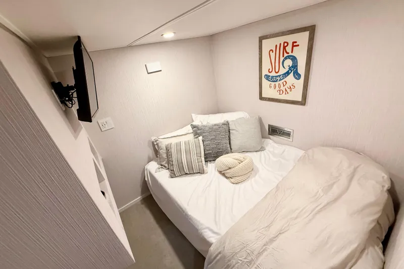 Slide: The Image of Cozy bedroom in 2021 BRAVADA YACHTS Atlas V Series 8018 with surf-themed decor. - 27