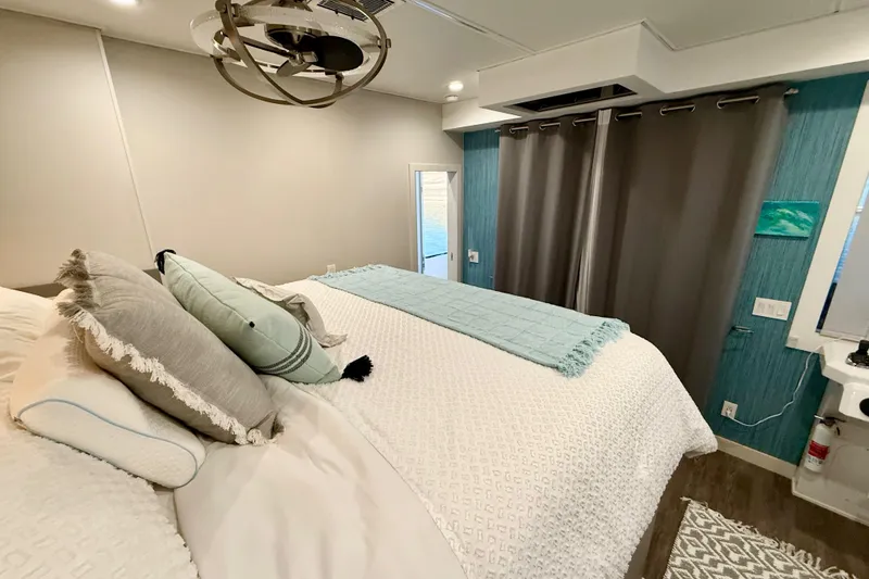 Slide: The Image of Luxurious bedroom interior on 2021 BRAVADA YACHTS Atlas V Series 8018, featuring elegant decor and cozy bedding. - 31