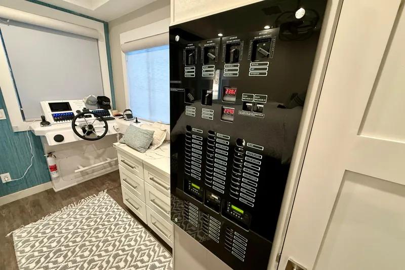 Slide: The Image of Control panel and helm station inside 2021 BRAVADA YACHTS Atlas V Series 8018. - 33