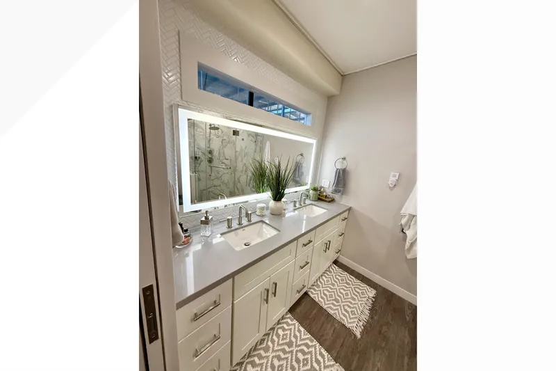 Slide: The Image of Luxurious bathroom in 2021 Bravada Yachts Atlas V Series 8018, featuring modern vanity and decor. - 36