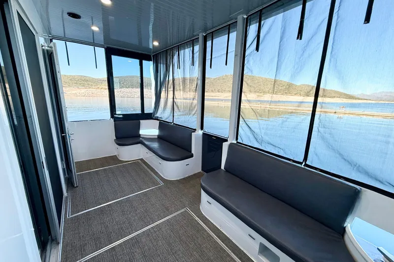 Slide: The Image of Interior of 2021 BRAVADA YACHTS Atlas V Series 8018 with lake view and seating. - 42