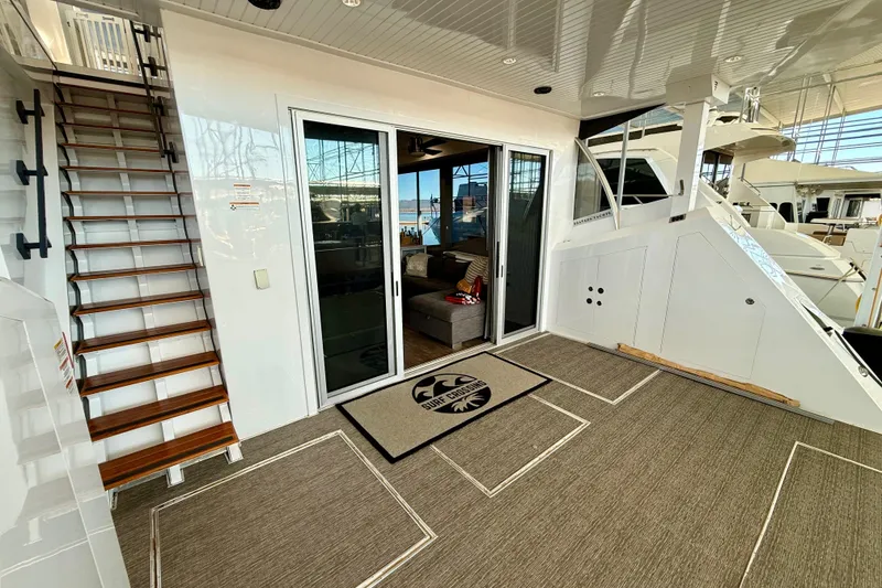 Slide: The Image of Luxurious 2021 Bravada Yachts Atlas V Series 8018 interior with elegant staircase and sliding doors. - 43