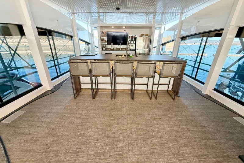 Slide: The Image of Luxurious interior of 2021 BRAVADA YACHTS Atlas V Series 8018 with modern bar and seating. - 53