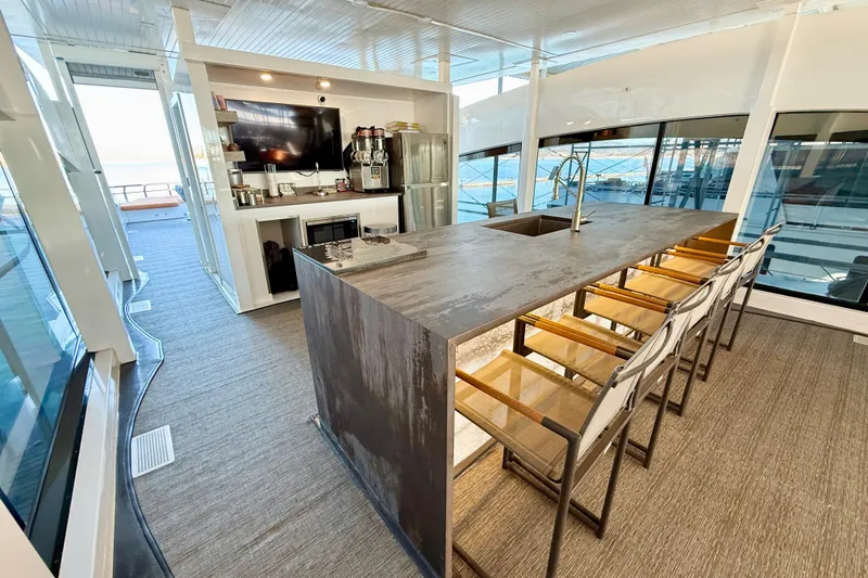 Slide: The Image of Luxurious interior of 2021 BRAVADA YACHTS Atlas V Series 8018 with modern kitchen and seating area. - 54