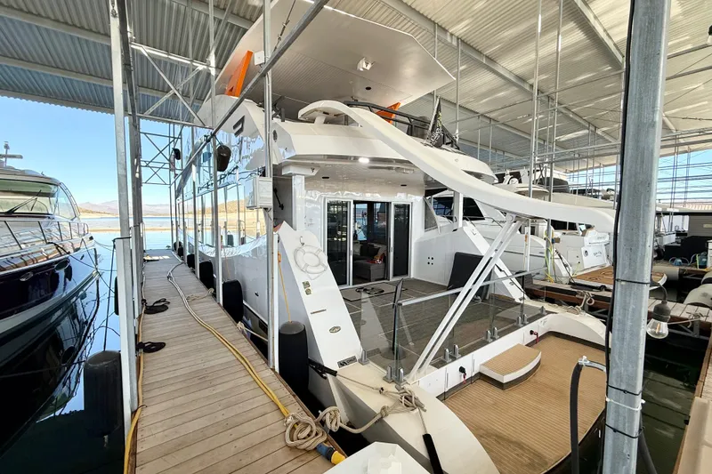 Slide: The Image of 2021 BRAVADA YACHTS Atlas V Series 8018 docked in a marina. - 67