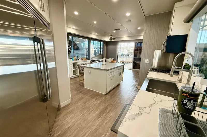 Slide: The Image of Luxurious kitchen interior on 2021 BRAVADA YACHTS Atlas V Series 8018, featuring modern appliances and sleek design. - 9