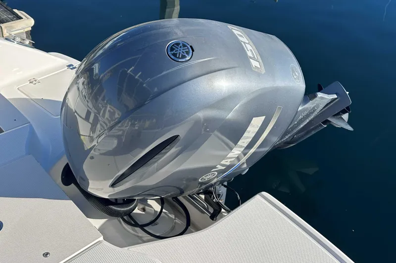 Slide: The Image of 2018 Robalo R200 Center Console with Yamaha outboard engine on water. - 2