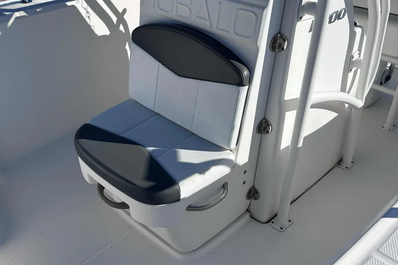 Slide: The Image of 2018 Robalo R200 Center Console boat seat with black and white upholstery. - 6