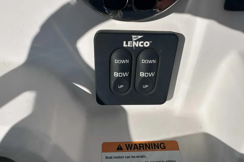 Slide: The Image of Lenco trim tab controls on 2018 Robalo R200 Center Console boat. - 9