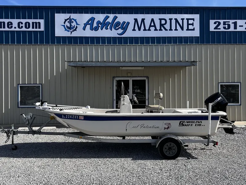 Slide: The Image of 2024 Carolina Skiff JVX18CC in front of Ashley Marine building. - 1
