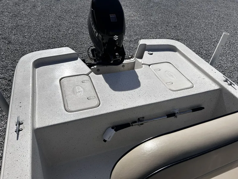 Slide: The Image of 2024 Carolina Skiff JVX18CC boat rear with motor. - 10